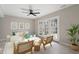 Bright living room with modern furniture, light wood floors, and French doors at 3 Patriot Cir, Durham, NC 27704
