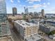 Aerial perspective of an apartment building in the city, surrounded by other buildings and roads at 317 W Morgan Street # 405, Raleigh, NC 27601