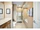 Spacious bathroom features a glass shower, soaking tub and large vanity at 317 W Morgan Street # 405, Raleigh, NC 27601
