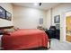 Comfortable bedroom with acoustic guitars, and view of the main bathroom at 317 W Morgan Street # 405, Raleigh, NC 27601
