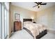 Cozy bedroom with a ceiling fan and bright natural light at 317 W Morgan Street # 405, Raleigh, NC 27601