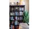 A full bookshelf shows a wide variety of books and decorative items at 317 W Morgan Street # 405, Raleigh, NC 27601