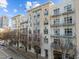 Multi-story apartment building with balconies, situated on a city street with parking at 317 W Morgan Street # 405, Raleigh, NC 27601