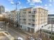 Modern apartment building on a city street with parking and nearby structures at 317 W Morgan Street # 405, Raleigh, NC 27601