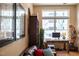 Comfortable home office with a wooden desk, a bookshelf and ample natural light at 317 W Morgan Street # 405, Raleigh, NC 27601