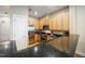 Bright kitchen features stainless appliances, granite counters, and ample cabinet space at 317 W Morgan Street # 405, Raleigh, NC 27601