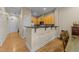 Open concept kitchen with breakfast bar and hardwood floors at 317 W Morgan Street # 405, Raleigh, NC 27601