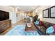 Comfortable condo with hardwood floors and open layout with views of the kitchen and cozy living spaces at 317 W Morgan Street # 405, Raleigh, NC 27601