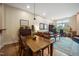 Cozy living room area with hardwood floors, leather sofa, and a workspace with a view for work or relaxation at 317 W Morgan Street # 405, Raleigh, NC 27601