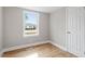 Well-lit bedroom with hardwood floors and a closet at 322 Pace St, Smithfield, NC 27577