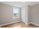 Well-lit bedroom with hardwood floors and a closet at 322 Pace St, Smithfield, NC 27577