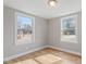 Spacious bedroom with hardwood floors and two windows at 322 Pace St, Smithfield, NC 27577