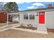 Charming ranch home with a red door and covered porch at 322 Pace St, Smithfield, NC 27577