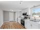 Bright kitchen with stainless steel appliances and white shaker cabinets at 322 Pace St, Smithfield, NC 27577