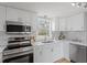Modern kitchen with stainless steel appliances and white cabinets at 322 Pace St, Smithfield, NC 27577