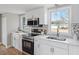 Modern kitchen with stainless steel appliances and white cabinets at 322 Pace St, Smithfield, NC 27577