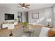 Open living room with hardwood floors and a view into the kitchen at 322 Pace St, Smithfield, NC 27577