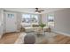 Bright living room boasts hardwood floors, natural light, and stylish contemporary furniture at 322 Pace St, Smithfield, NC 27577