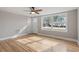 Living room with hardwood floors, ceiling fan and exterior view at 322 Pace St, Smithfield, NC 27577