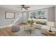 Spacious living room with hardwood floors and large windows at 322 Pace St, Smithfield, NC 27577