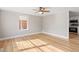 Bright living room with hardwood floors and ceiling fan at 322 Pace St, Smithfield, NC 27577