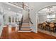 Grand foyer with hardwood floors, staircase, and views into the living and dining rooms at 3225 Mossy Ridge Ct, Raleigh, NC 27613