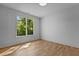 Bright, airy bedroom with hardwood flooring, large windows offering scenic views at 324 Waldo St, Cary, NC 27511