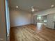 Bright bedroom with hardwood floors, neutral walls, and doorway to an adjacent living space at 324 Waldo St, Cary, NC 27511