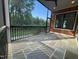Spacious screened porch with slate flooring offers a relaxing outdoor retreat overlooking the yard at 324 Waldo St, Cary, NC 27511