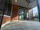 Covered patio featuring wood paneled walls, a ceiling fan, and slate tiles for an elegant outdoor space at 324 Waldo St, Cary, NC 27511
