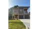 Modern two-story home with wood and gray siding, two-car garage, and well-manicured lawn at 324 Waldo St, Cary, NC 27511