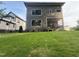 Modern home exterior with large windows and a screened in back porch, set in a lush green yard at 324 Waldo St, Cary, NC 27511