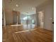 Foyer with wood floors, modern railing, pendant lighting, and lots of light at 324 Waldo St, Cary, NC 27511
