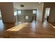 Foyer with wood floors, modern railing, pendant lighting, and natural light at 324 Waldo St, Cary, NC 27511