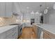 Bright, modern kitchen with a large island, stainless steel appliances, and custom cabinets at 324 Waldo St, Cary, NC 27511