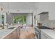 Spacious kitchen with island and barstools seamlessly connects to the dining area at 324 Waldo St, Cary, NC 27511