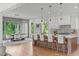 Bright kitchen with an island, bar seating, pendant lighting, and an eat-in area with large windows at 324 Waldo St, Cary, NC 27511