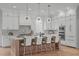 Stylish kitchen with a large island, modern lighting, and stainless steel appliances at 324 Waldo St, Cary, NC 27511