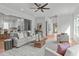Open concept living room with contemporary decor and seamless flow to the kitchen at 324 Waldo St, Cary, NC 27511