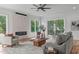 Inviting living room with fireplace, large windows, and access to an outdoor deck at 324 Waldo St, Cary, NC 27511