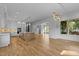 Open concept living area featuring a kitchen, dining room, hardwood floors and natural light at 324 Waldo St, Cary, NC 27511