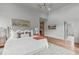 Bright main bedroom with a neutral color palette, area rug, and walk-in closet at 324 Waldo St, Cary, NC 27511