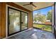 Screened-in porch with sliding glass door, slate flooring, and view of the backyard at 324 Waldo St, Cary, NC 27511