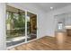 Screened-in porch with stone flooring and sliding glass door at 324 Waldo St, Cary, NC 27511