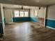 Living room with wood-look floors and brick fireplace at 3395 Nc Hwy 210, Smithfield, NC 27577
