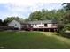 Spacious backyard with large deck and hot tub at 3413 Thistledown Ct, Efland, NC 27243