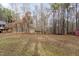 Spacious backyard with storage shed and wooded area at 3413 Thistledown Ct, Efland, NC 27243