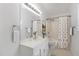 Bright bathroom featuring vanity with great lighting and a shower-tub combo with a showerhead and curtain at 3413 Thistledown Ct, Efland, NC 27243