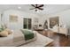 Bright primary bedroom with hardwood floors, large windows, and a private balcony at 3413 Thistledown Ct, Efland, NC 27243