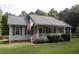 Gray house with white trim, gray shutters, and a white porch at 3413 Thistledown Ct, Efland, NC 27243